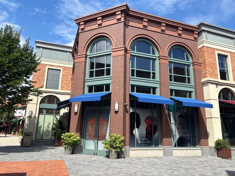 Belmont Park Village storefront with October 2026 opening posters